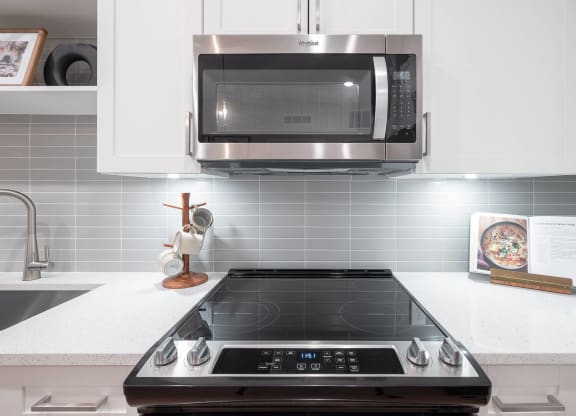 a kitchen with a stove and a microwave