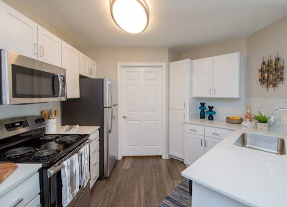 Kitchen with white counter and sink at The Arden, Gresham, 97080
