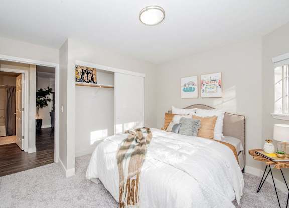 Bedroom with a bed and closet at The Arden, Gresham, OR