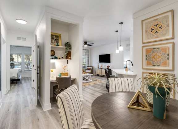 A modern living room with a striped sofa and a coffee table.