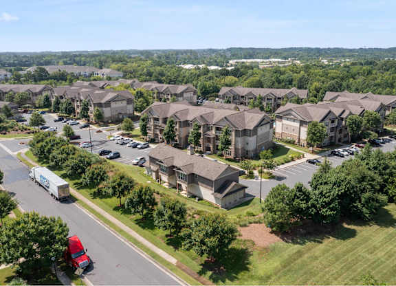 A large group of houses are seen from an aerial view.