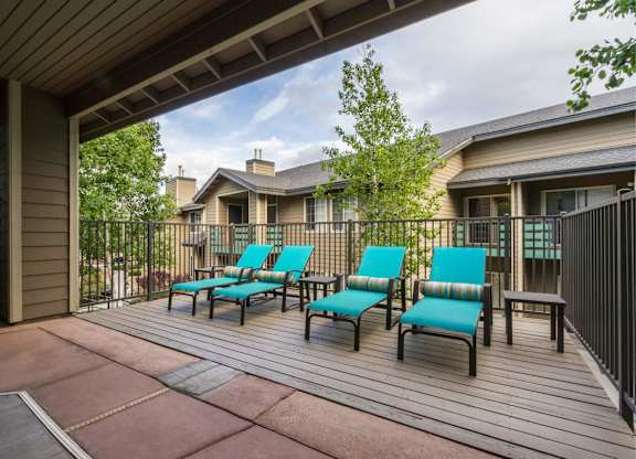 A Patio With Blue Chairs at The Summit at Flagstaff, Flagstaff