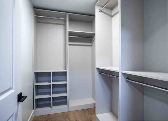 A white closet with shelves and drawers.