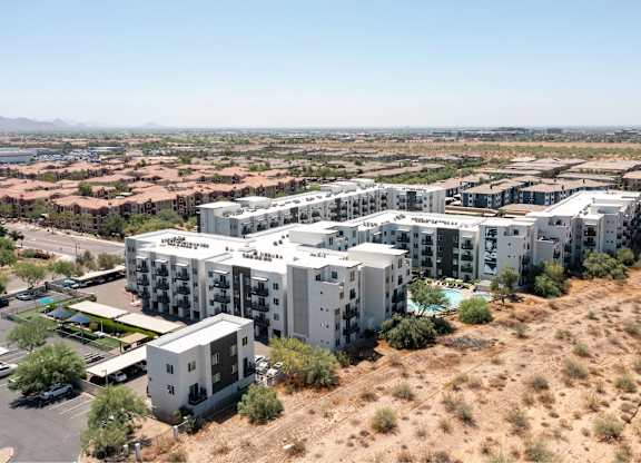 an aerial view of slate scottsdale large apartment complex in the middle of a desert