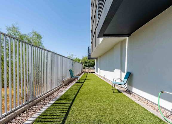 our apartments have a private patio with chairs and a dog park