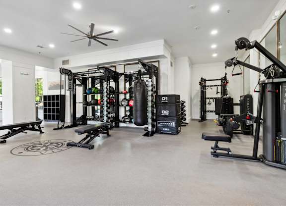 A spacious home gym with a variety of equipment.