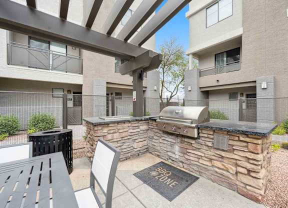 A BBQ zone is located in the courtyard of a residential building.