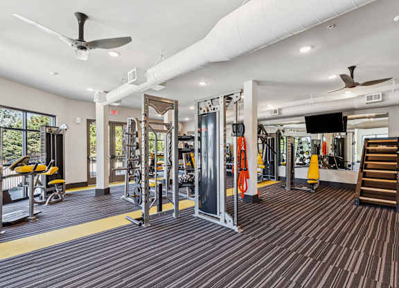 the gym at the enclave at woodbridge apartments in sugar land, tx