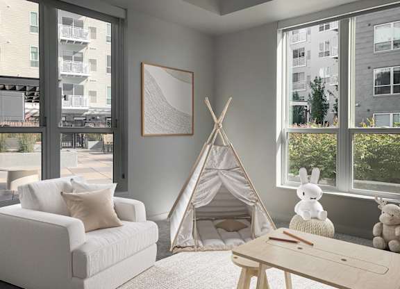 a living room with a teepee and a couch and a coffee table