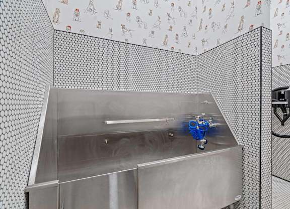 a stainless steel sink in pet spa at The Hallon Apartments,  Hopkins, MN, 55343