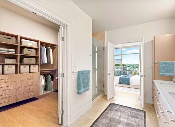 A bathroom with a view of the city.