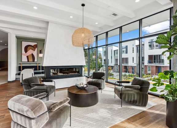A modern living room with a fireplace and comfortable seating.