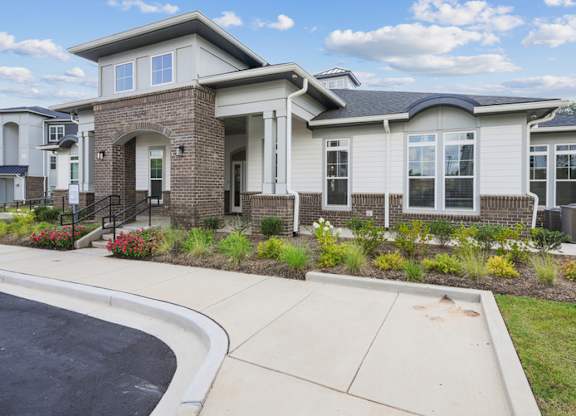 A house with a driveway in front of it.