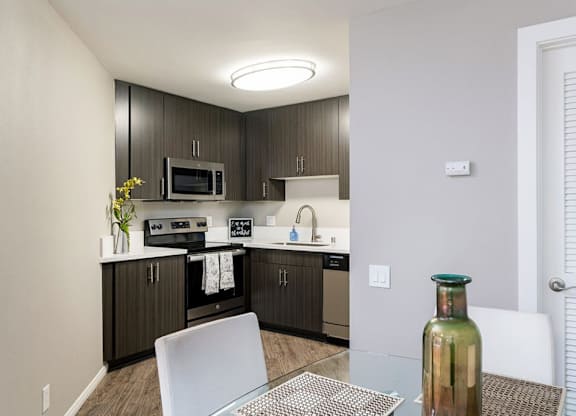 Kitchen with Dining Area at Village Square, La Jolla California