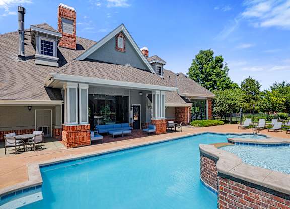 A house with a pool in the backyard.