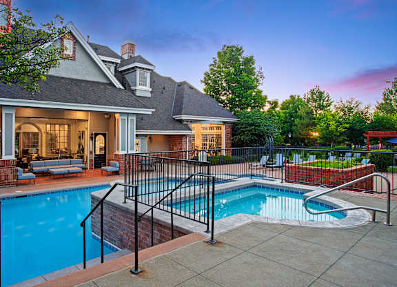 A house with a pool in the backyard.