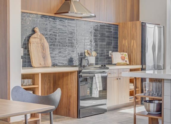 a kitchen with a stove and a refrigerator
