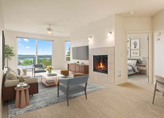 A living room with a fireplace and a television.