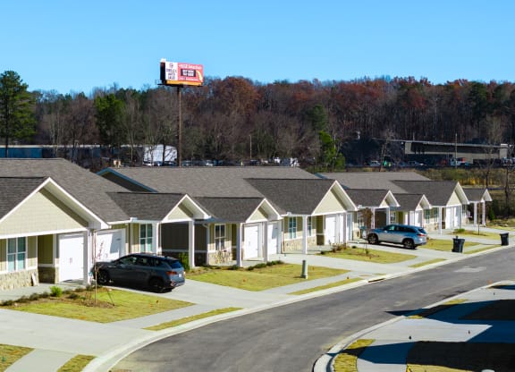 a row of houses on the side of a road