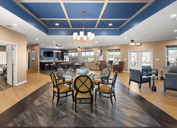 a large dining room with a table and chairs