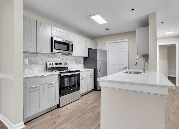 Kitchen with stainless steel appliances at Bridgewater affordable apartments in Duluth
