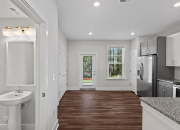 a kitchen with a sink and a refrigerator