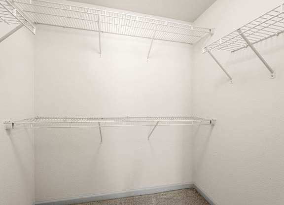 Empty white shelving unit in a room.