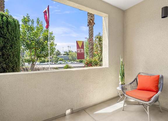 A personal patio with a lounge chair.