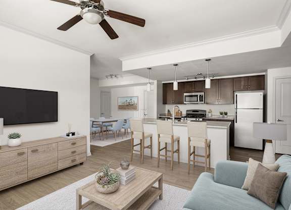 A spacious living room with a couch, coffee table, and view of a kitchen