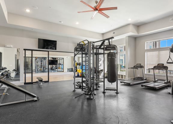 Fitness center with yoga studio, treadmills, and free-weights