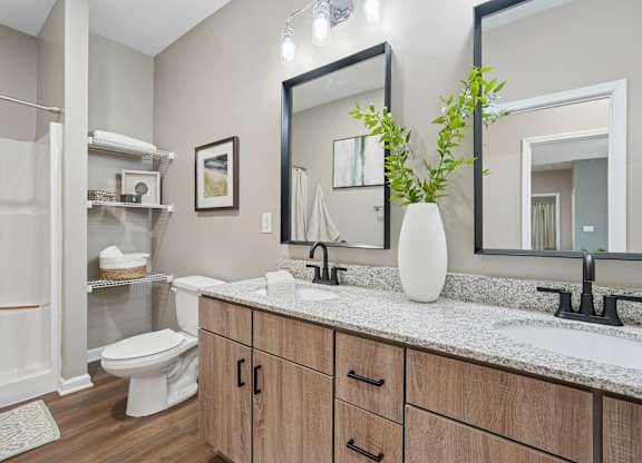 A bathroom with a white toilet and a white sink.