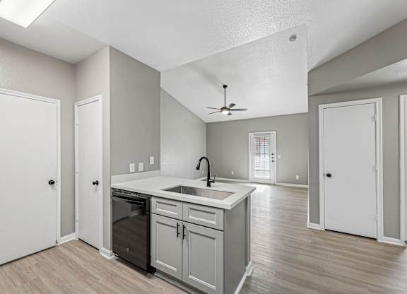 A kitchen with a fan on the ceiling and a sink with a faucet at Clear Creek Meadows Apartments, Texas, 76522
