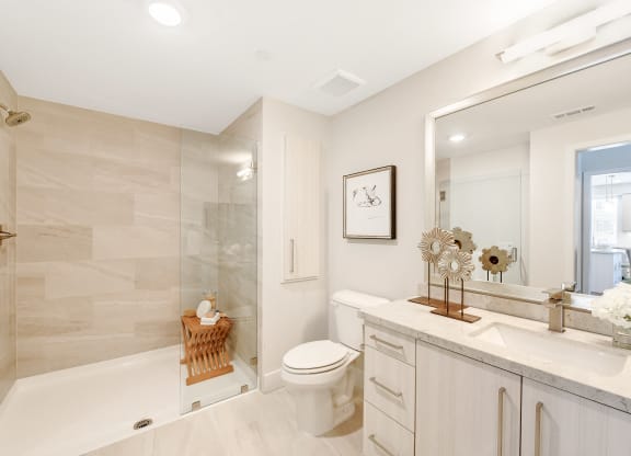 White bathroom with a shower at Sola at Pacific Highlands Ranch Apartments, California, 92130