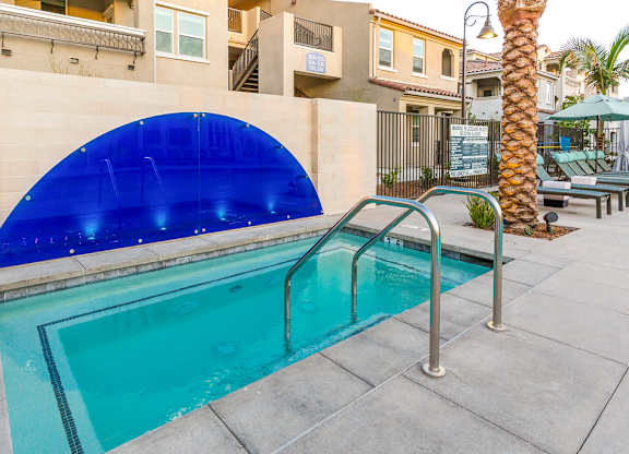 A swimming pool with a blue tinted cover.