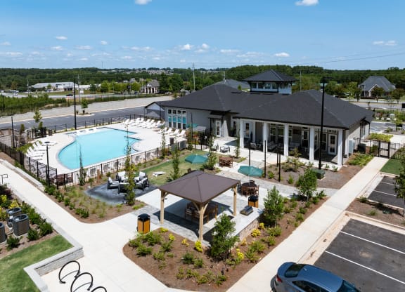 an aerial view of a building with a swimming pool