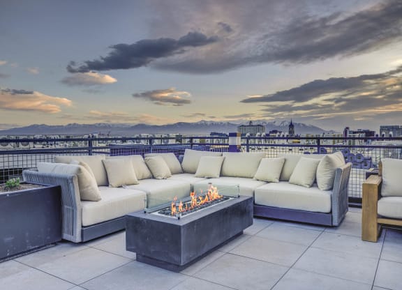 patio has a view of the city and the mountains in the background