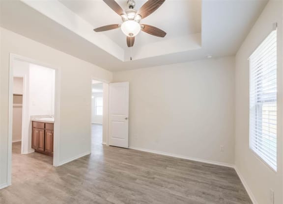 a living room with a ceiling fan at The Village at Caney Mills, Texas, 77303 