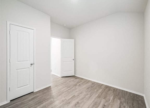 Contemporary Finishes Include Wood And Tile Floorin at The Village at Caney Mills, Conroe, TXg
