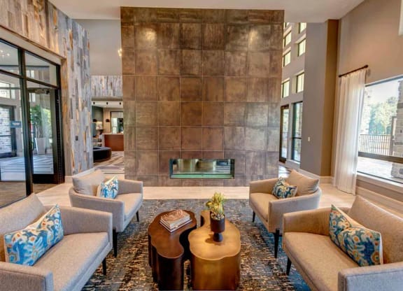 a large living room with couches and a fireplace