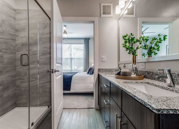 a bathroom with a sink and a shower