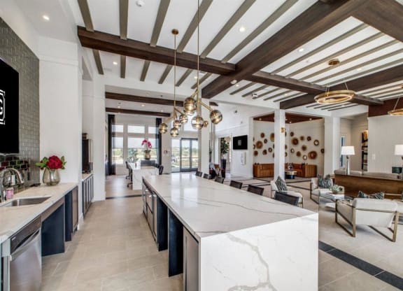 a large kitchen with a marble counter top