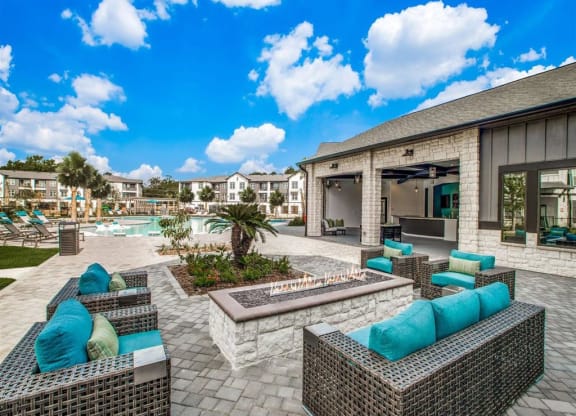 an outdoor patio with furniture and a pool