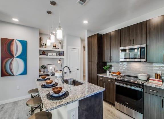 a kitchen with a counter top and a sink