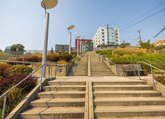 a set of stairs in a city with a building in the background
