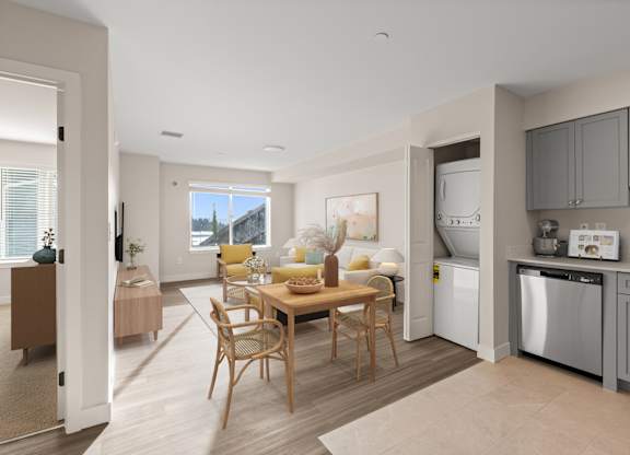 A modern kitchen with a dining table and chairs.