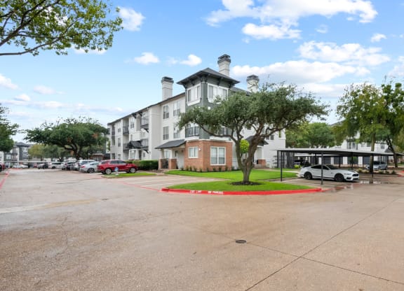 an empty parking lot in front of an apartment building at Mission Gate, Texas