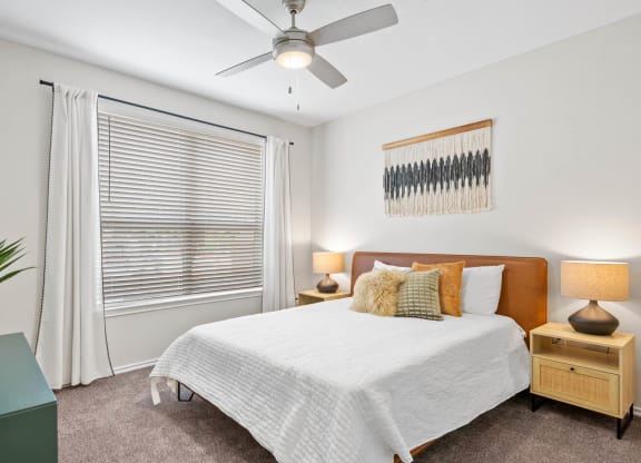 a bedroom with a bed and a ceiling fan at Mission Gate, Plano, 75024