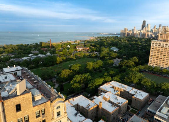 an aerial view of the city and the lake at the Belden Stratford in Chicago, Illinois 60614