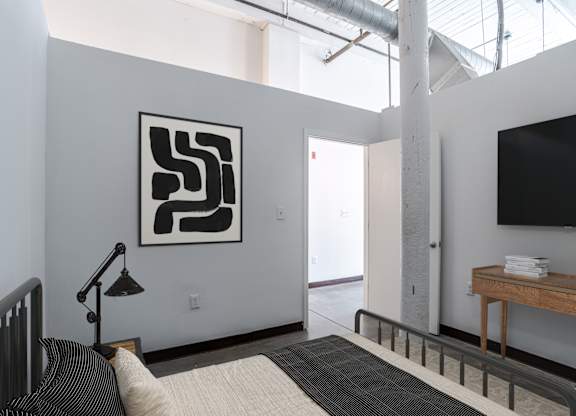 Chic bedroom at Highland Mill Lofts in Charlotte, NC