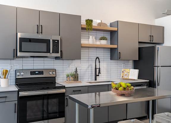 Kitchen with Stainless Steel Appliances  at Highland Mill Lofts in Charlotte, NC